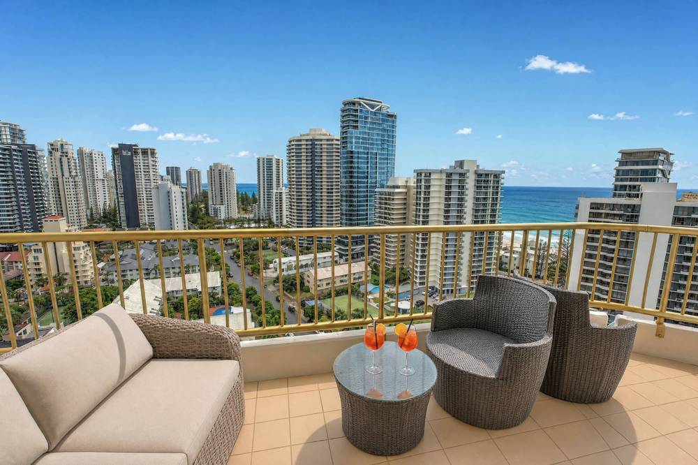 A wraparound apartment balcony overlooking the coast
