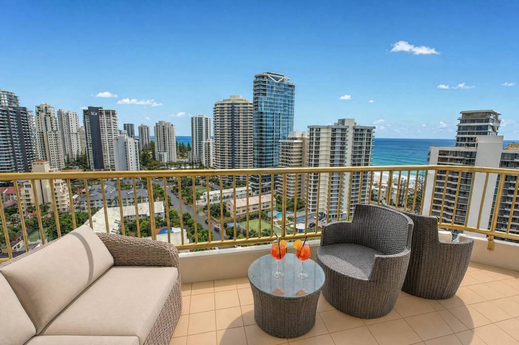 A wraparound apartment balcony overlooking the coast