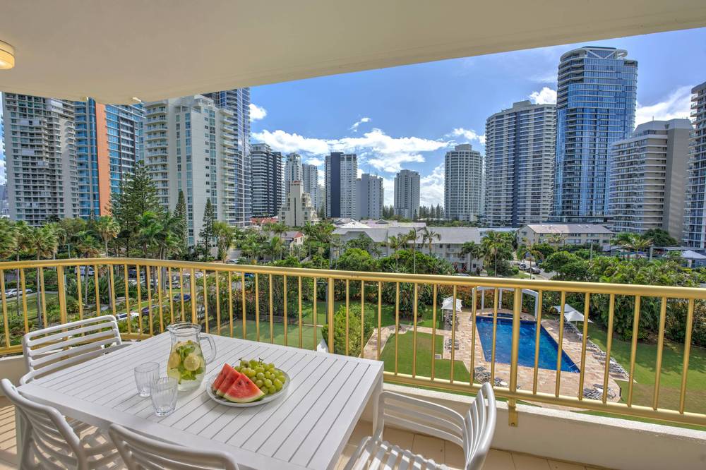 A wraparound apartment balcony with coastal views