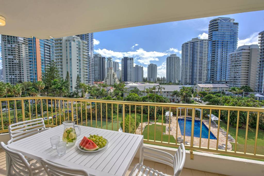 A wraparound apartment balcony with coastal views